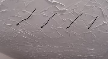 photo of a ceiling drywall with a sag in it