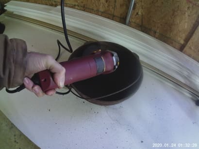 photo of grinder cleaning a cast iron pot