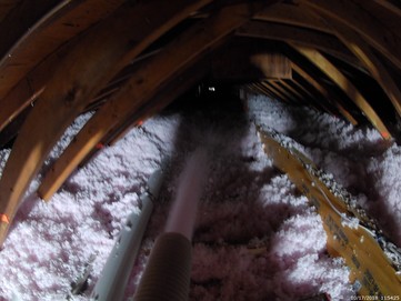 blown-in fiberglass insulation in the attic