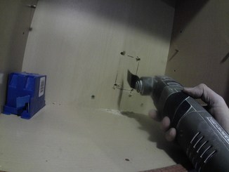 oscillating tool cutting back of cabinet